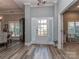 Inviting foyer with beautiful hardwood floors, a front door with sidelights, and open access to other rooms at 17709 Sedona Way, Cornelius, NC 28031