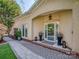 Charming front entrance featuring a brick path, elegant planters, and a stylish glass front door at 17709 Sedona Way, Cornelius, NC 28031