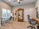 Comfortable office space with a work desk, large window, and doorway to the bathroom at 17709 Sedona Way, Cornelius, NC 28031