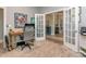 Bright home office with French doors, neutral paint, and carpet flooring at 17709 Sedona Way, Cornelius, NC 28031