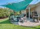 Inviting patio featuring a fire pit, comfortable lounge chairs, and lush green landscaping at 17709 Sedona Way, Cornelius, NC 28031