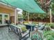 Cozy outdoor patio with comfortable seating, shaded by a stylish awning, and includes a grill at 17709 Sedona Way, Cornelius, NC 28031