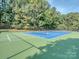 Well-maintained tennis court with vibrant blue and green surface, ready for a match at 17709 Sedona Way, Cornelius, NC 28031