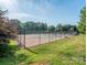 Outdoor tennis courts with a fence, offering a great space for sports and recreation at 17709 Sedona Way, Cornelius, NC 28031