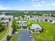 Aerial view of a community featuring a clubhouse, pool, tennis courts and lake access at 18568 Mainsail Ct, Lancaster, SC 29720