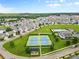 Aerial view of a community featuring a clubhouse, pool, tennis courts and green space at 18568 Mainsail Ct, Lancaster, SC 29720