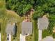 Aerial view of homes in a quiet community featuring manicured lawns and mature trees at 18568 Mainsail Ct, Lancaster, SC 29720
