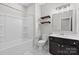 Bathroom featuring a bathtub and shower combination with a dark vanity with a white counter at 18568 Mainsail Ct, Lancaster, SC 29720
