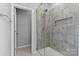 Modern bathroom featuring a glass-enclosed shower with sleek tile work and a built-in niche at 18568 Mainsail Ct, Lancaster, SC 29720
