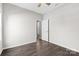 Empty bedroom with view of the doorway to the bathroom and hardwood floors at 18568 Mainsail Ct, Lancaster, SC 29720