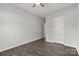 A cozy bedroom featuring hardwood floors and a ceiling fan for added comfort at 18568 Mainsail Ct, Lancaster, SC 29720
