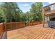 A spacious wooden deck featuring backyard views and stairs to spa at 18568 Mainsail Ct, Lancaster, SC 29720