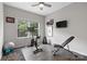 Home gym featuring exercise equipment, large windows, and hardwood floors at 18568 Mainsail Ct, Lancaster, SC 29720