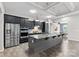 Modern kitchen with stainless steel appliances, a large island with granite countertops, and an open layout at 18568 Mainsail Ct, Lancaster, SC 29720
