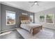 Cozy main bedroom with a ceiling fan, a decorative sign, and multiple windows at 18568 Mainsail Ct, Lancaster, SC 29720