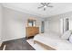 Bright bedroom with a ceiling fan, large dresser and view of the door to the bathroom at 18568 Mainsail Ct, Lancaster, SC 29720