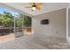 Screened porch featuring outdoor ceiling fan, tile flooring, and TV at 18568 Mainsail Ct, Lancaster, SC 29720