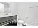 Well-maintained bathroom with modern vanity, toilet, and ample counter space at 2726 Tranquil Oak Pl, Charlotte, NC 28206