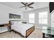 Cozy bedroom with neutral tones, complemented by a ceiling fan and stylish furniture at 2726 Tranquil Oak Pl, Charlotte, NC 28206