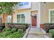 View of front door, with well-maintained landscaping, and brick accents at 2726 Tranquil Oak Pl, Charlotte, NC 28206