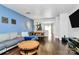 Open-concept living space showcasing a stylish design with hardwood floors and modern decor at 2726 Tranquil Oak Pl, Charlotte, NC 28206