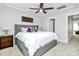 Comfortable main bedroom with tray ceiling, ceiling fan, and a large bed with plush bedding at 2726 Tranquil Oak Pl, Charlotte, NC 28206