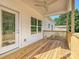 Outdoor back porch with wood flooring and white railings, perfect for relaxing at 286 Old Pinckney Rd, York, SC 29745