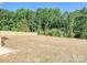 Spacious, level backyard enclosed by a new wooden fence, perfect for outdoor activities at 286 Old Pinckney Rd, York, SC 29745