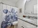 Bathroom with granite countertop vanity, and a shower featuring a blue floral curtain at 286 Old Pinckney Rd, York, SC 29745