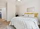 Bedroom with light walls, ceiling fan, view into bathroom, and tastefully coordinated decor at 286 Old Pinckney Rd, York, SC 29745