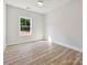 Bright bedroom featuring a ceiling fan, a window and light hardwood floors at 286 Old Pinckney Rd, York, SC 29745