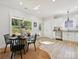 Cozy dining nook with natural light, wood floors, and a view of the wooded backyard at 286 Old Pinckney Rd, York, SC 29745