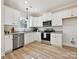 Charming kitchen with white cabinets, stainless steel appliances, granite countertops and recessed lighting at 286 Old Pinckney Rd, York, SC 29745