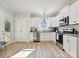 Bright kitchen with white cabinets, stainless steel appliances, granite countertops, and lots of natural light at 286 Old Pinckney Rd, York, SC 29745