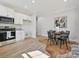 Eat-in kitchen with stainless steel appliances, white cabinets, light countertops, and adjacent dining area at 286 Old Pinckney Rd, York, SC 29745