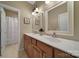Well-lit bathroom with a double sink vanity and neutral decor at 2909 Julian Glen Cir, Waxhaw, NC 28173