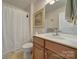 Bathroom with vanity, toilet, shower and framed mirror at 2909 Julian Glen Cir, Waxhaw, NC 28173