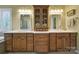 Lovely bathroom features a dual vanity, with wood cabinets and drawers, topped with a white countertop at 2909 Julian Glen Cir, Waxhaw, NC 28173