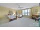 Large bedroom with two beds, a ceiling fan, and lots of natural light at 2909 Julian Glen Cir, Waxhaw, NC 28173