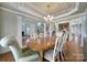Dining room with ample seating and views to a staircase and living room at 2909 Julian Glen Cir, Waxhaw, NC 28173