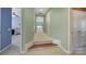 Hallway with neutral carpet leading to various rooms in the home at 2909 Julian Glen Cir, Waxhaw, NC 28173