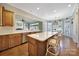 Well-lit kitchen with a large island, stainless steel appliances, and adjacent dining area at 2909 Julian Glen Cir, Waxhaw, NC 28173
