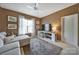 Inviting living room featuring a lounge sofa, neutral walls, and a patterned rug over a carpeted floor at 2909 Julian Glen Cir, Waxhaw, NC 28173