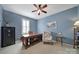 Home office with blue walls, a ceiling fan, and a traditional wooden desk at 2909 Julian Glen Cir, Waxhaw, NC 28173