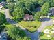 Aerial view showing the property line of a red-brick house on a corner lot with a landscaped yard at 3401 Cresta Ct, Charlotte, NC 28269
