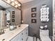 Bathroom features a double sink, large mirror, and stacked towels for a spa-like feel at 3401 Cresta Ct, Charlotte, NC 28269