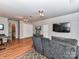 Bonus room with large seating area, hardwood floors, and plenty of natural light at 3401 Cresta Ct, Charlotte, NC 28269