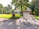 Traditional brick home with a spacious driveway, well-kept lawn, and professional landscaping at 3401 Cresta Ct, Charlotte, NC 28269