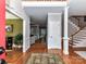 Welcoming foyer features hardwood floors and staircase, creating an inviting entrance at 3401 Cresta Ct, Charlotte, NC 28269