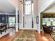 Grand foyer with large windows, hardwood floors, and elegant lighting fixtures create a stunning entry at 3401 Cresta Ct, Charlotte, NC 28269